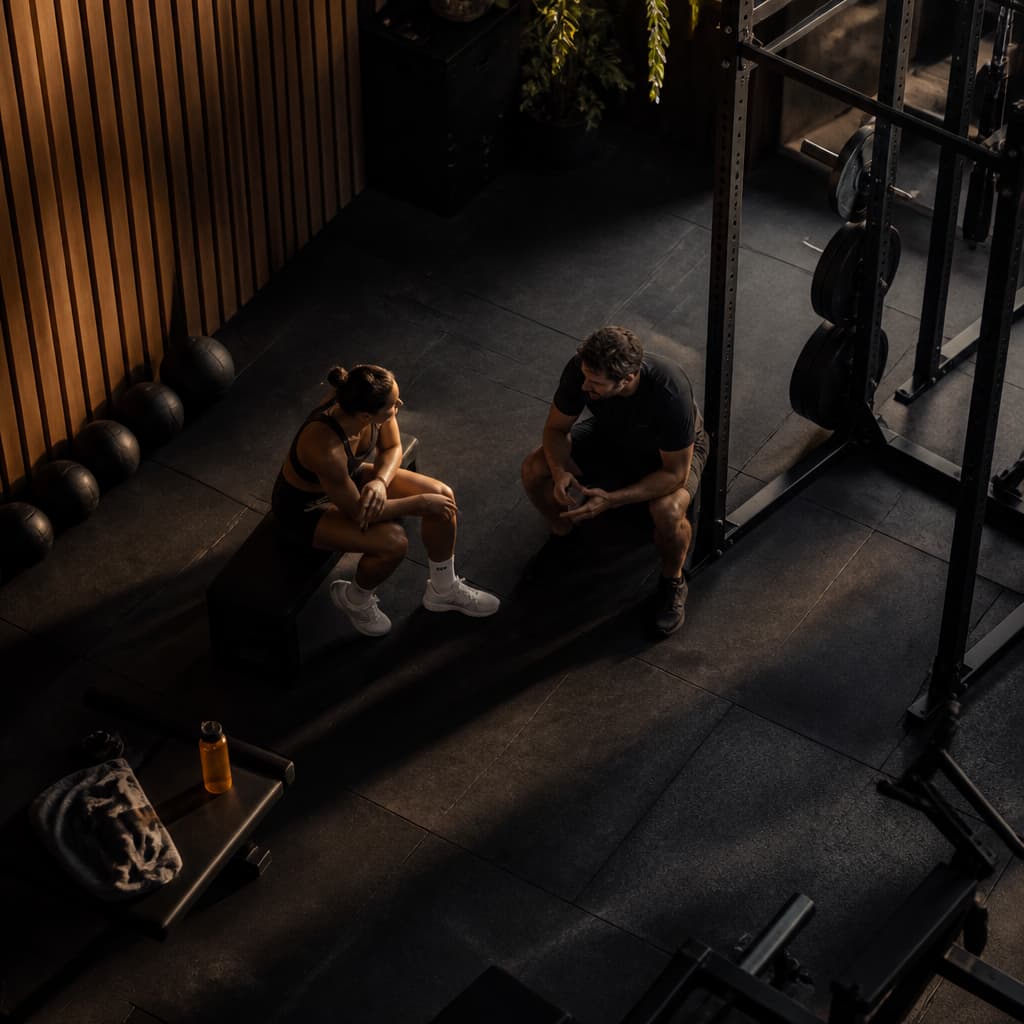Elite athlete and coach discussing a training decision.